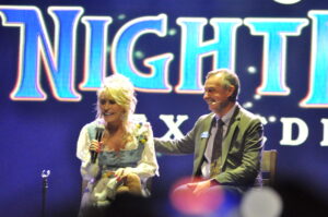 Dolly Parton and Eugene Naughton at the opening of the 2026 Dollywood season.