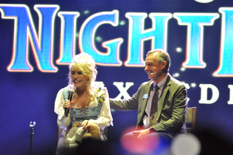 Dolly Parton and Eugene Naughton at the opening of the 2026 Dollywood season.